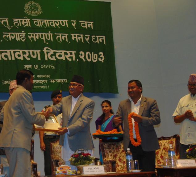 Ram Charitra Sah receiving Environment Conservation Award 2016 from Rt. Honorable Prime Minister, K.P. Sharma Oli