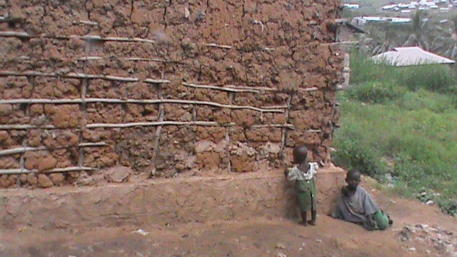 Children near mud house in sector 4 of the study area
