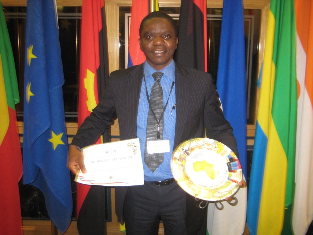 Gilbert Kuepouo, Executive Director of CREPD, with the SAICM award