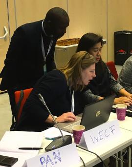 Griffins Ochieng (CEJAD), Johanna Hausmann (WECF) and Lia Esquillo (IPEN / EcoWaste Coalition) looking at questions for the group discussion