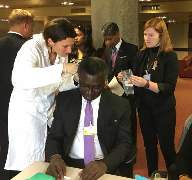 Prof. Kwabena Frimpong-Boateng, Minister for Environment, Science, Technology and Innovation (Ghana) getting his hair cut to test for mercury levels