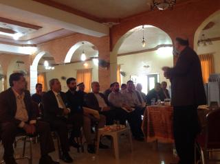 Participants listening to presentation at LHAP event