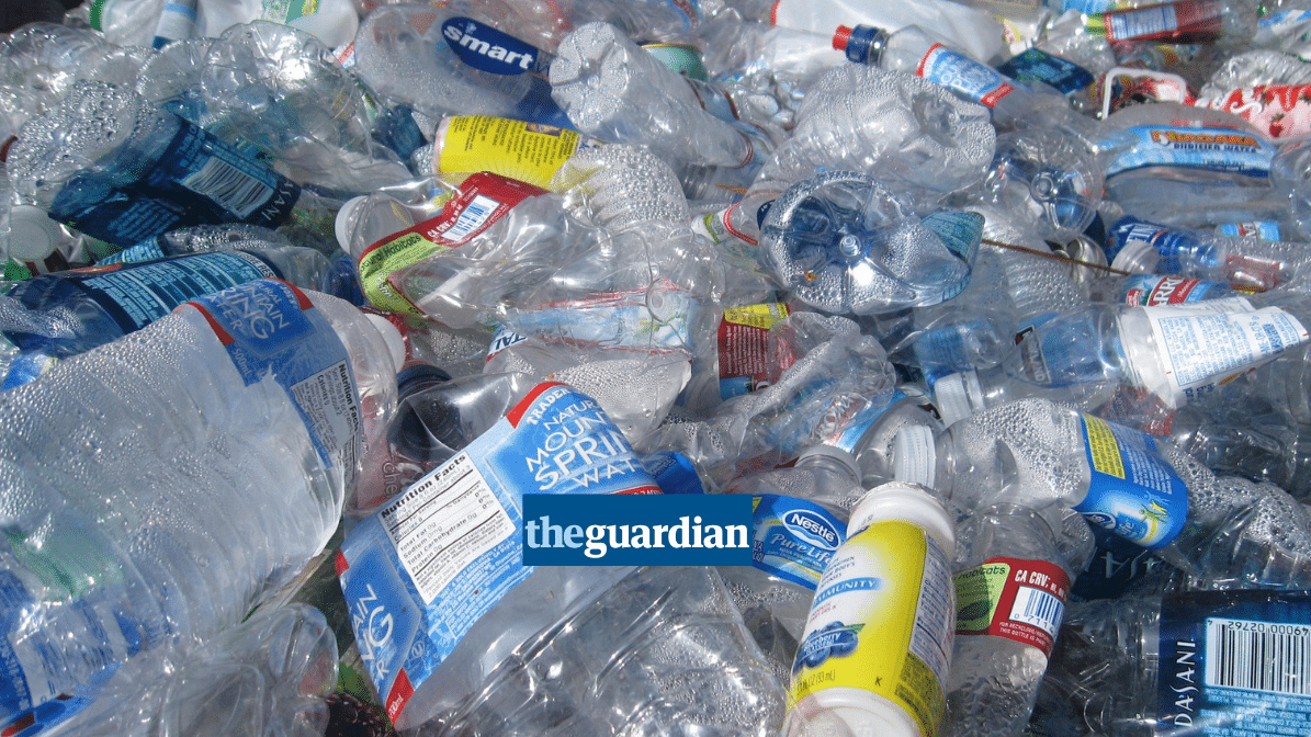 a large pile of plastic bottles, Guardian logo in foreground
