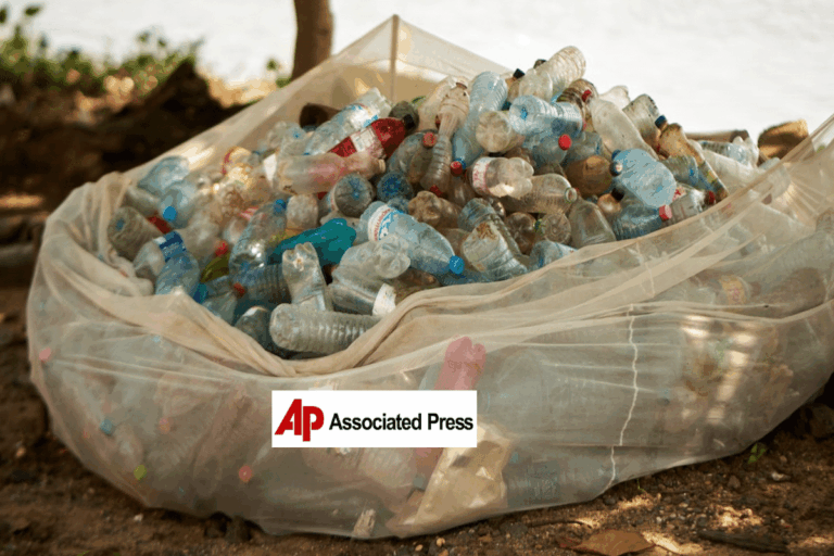 a large bag of plastic bottles, AP logo in foreground
