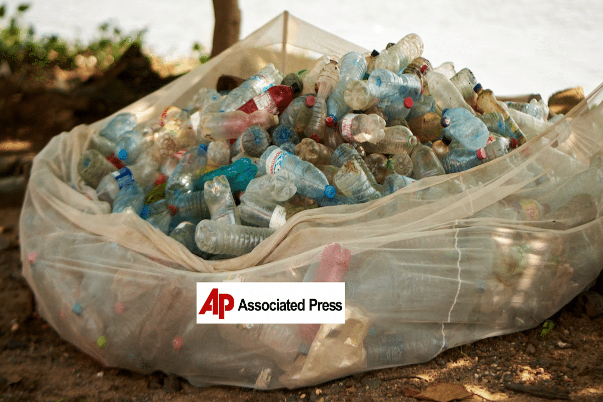 a large bag of plastic bottles, AP logo in foreground