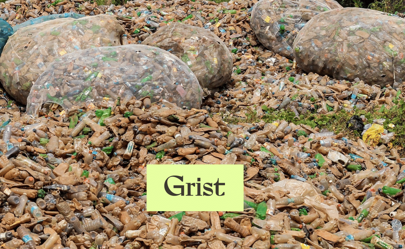 A large pile of discarded plastic bottles and containers fills the area, with several large transparent bags holding more plastic waste. A yellow box with the word Grist appears in the foreground.