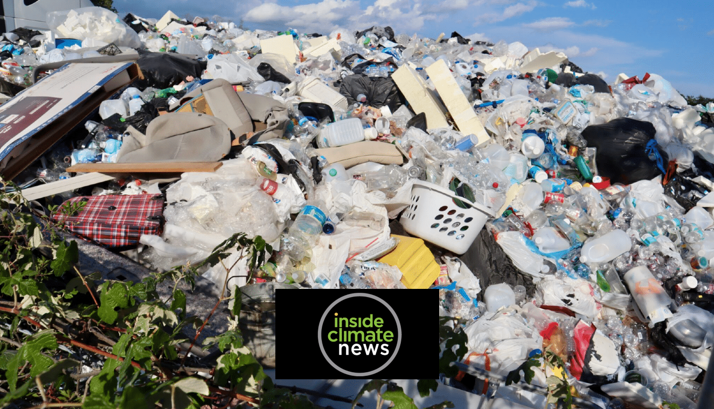 A large pile of assorted trash, including plastic bottles, bags, furniture, and household items, sits outdoors under a blue sky. The Inside Climate News logo appears at the bottom center.