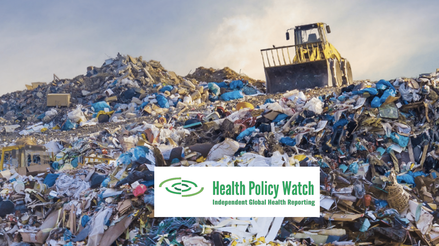 A large bulldozer sits on top of a pile of mixed waste at a landfill under a cloudy sky. The image includes the Health Policy Watch logo and tagline at the bottom center.