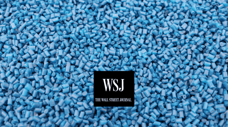 Blue plastic pellets with Wall Street Journal logo in foreground