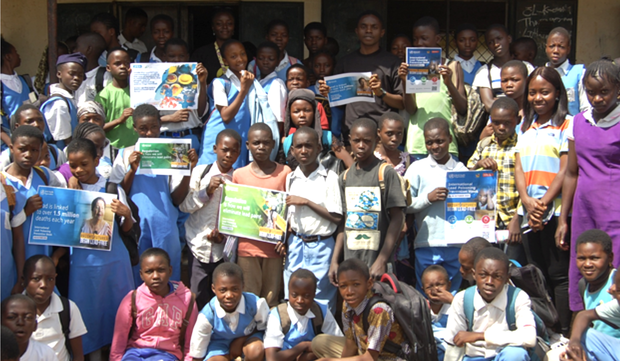 kids in Nigeria with lead-free paint signs