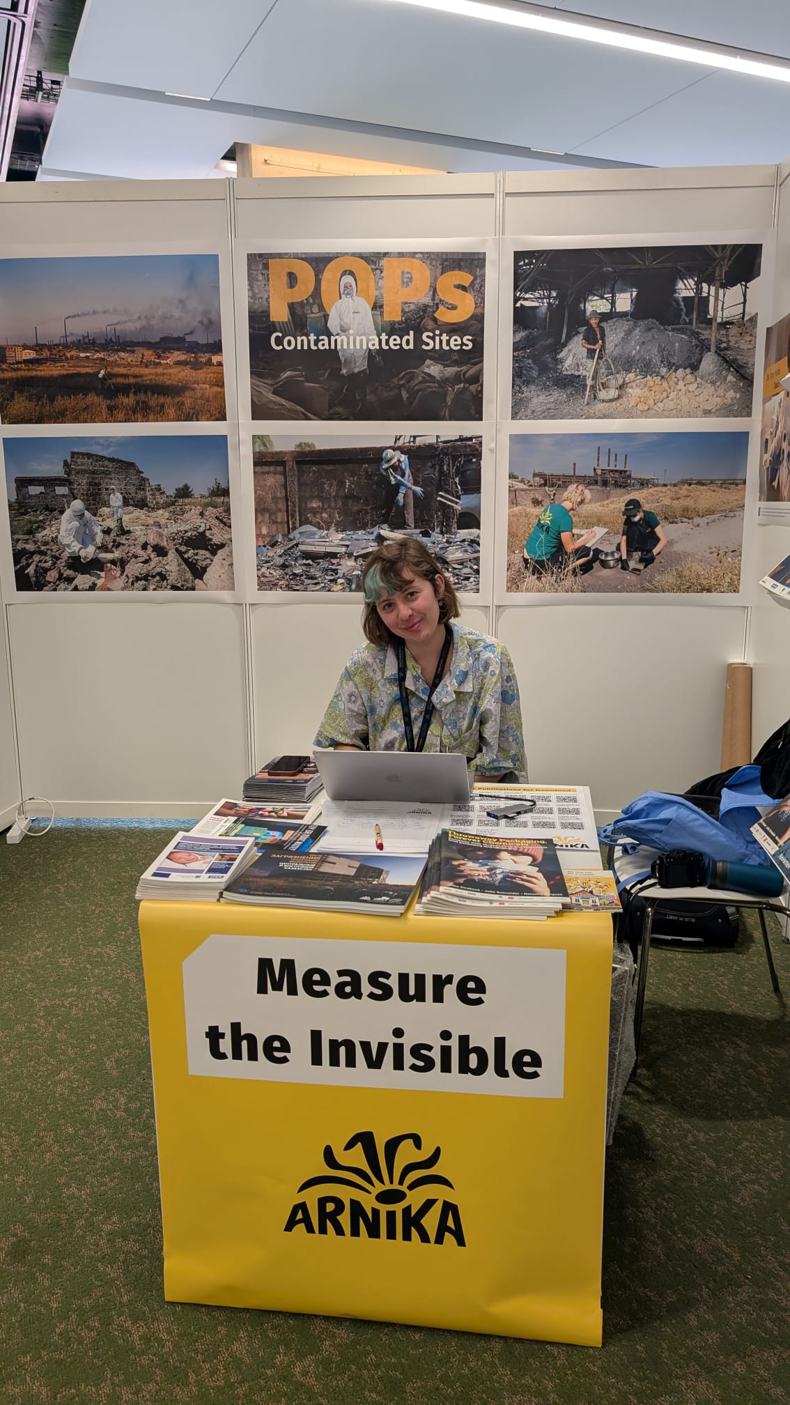 Arnika staff person at their booth at BRS COP 2025
